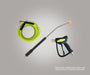 Green and black pressure washer gun with hose on a gray background